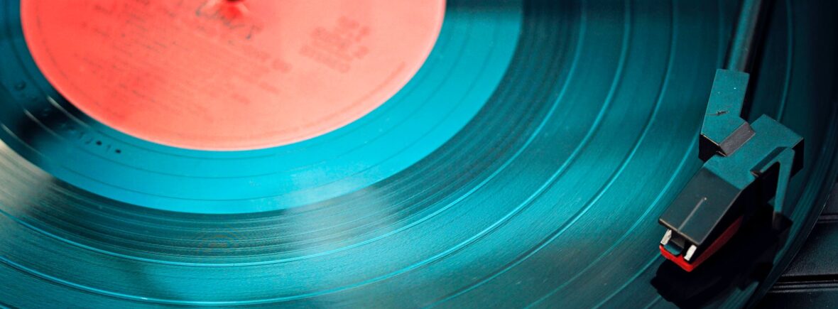 black vinyl record playing on turntable