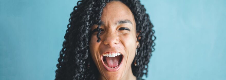 woman in knitted shirt is screaming