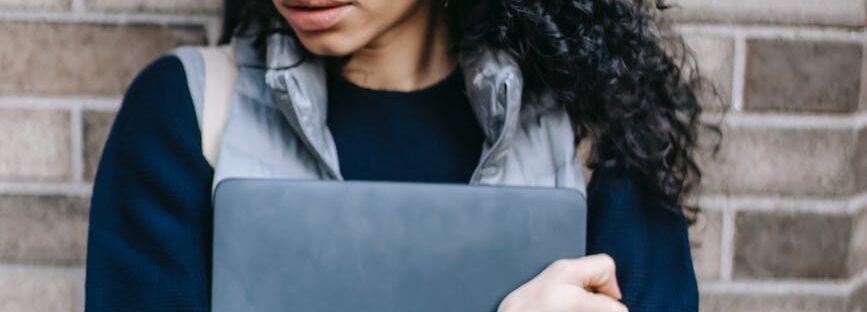 unhappy latin american woman with laptop