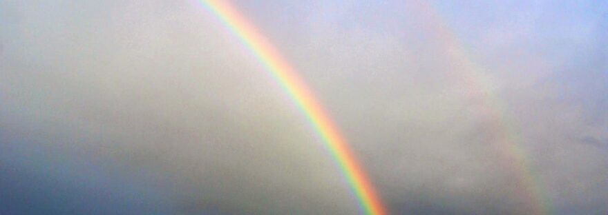 photography of rainbow during cloudy sky