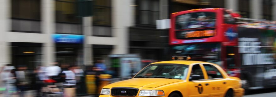 selective focus photography of yellow sedan