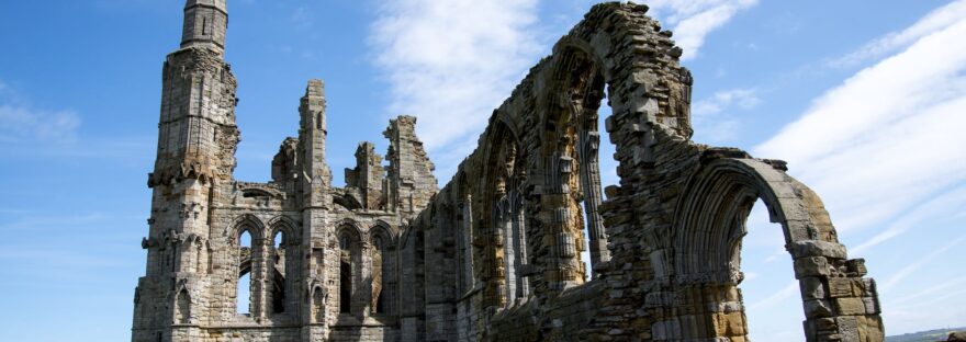 grey concrete ruins under blue white day time