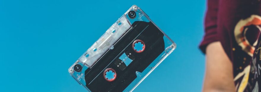 person doing tricks on cassette tape