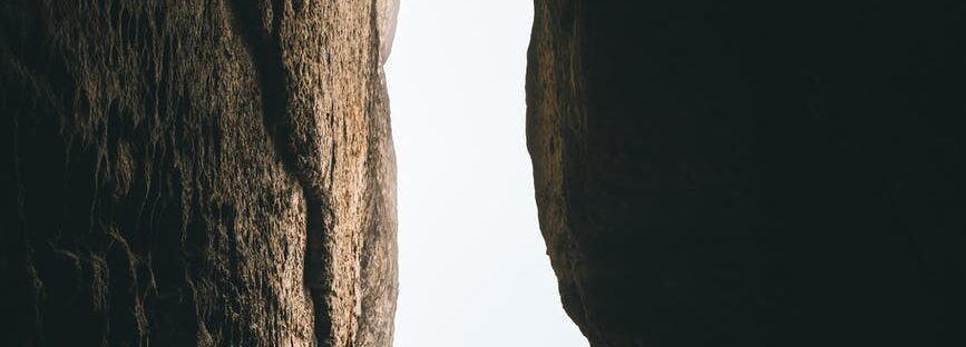 person standing on rock formation