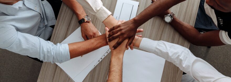 man and woman holding each other s hands as a team