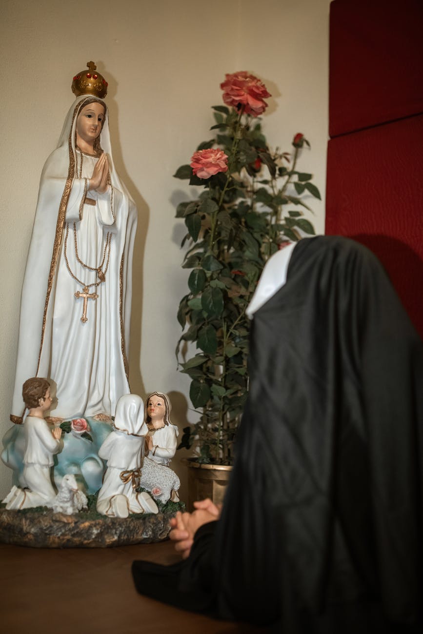 virgin mary figurine on table