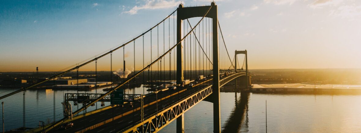 majestic suspension bridge over river in bright sunshine