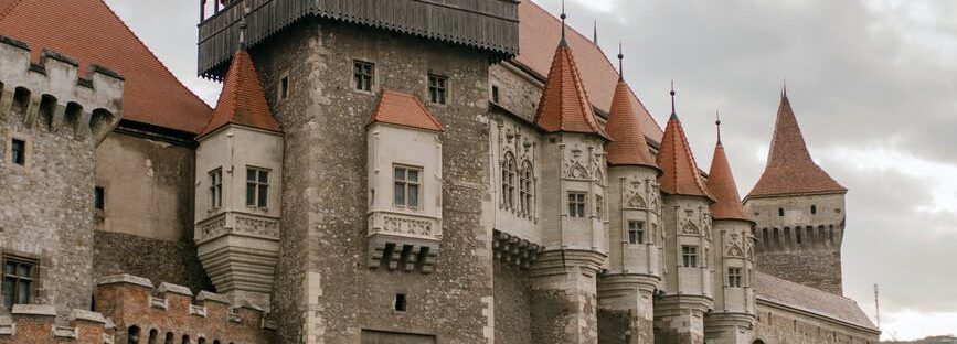 gothic majestic castle under cloudy sky