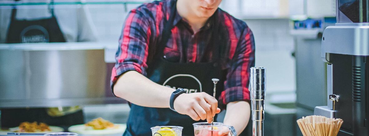 man holding drinking glass