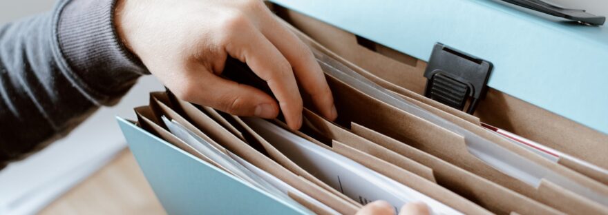 person choosing document in folder