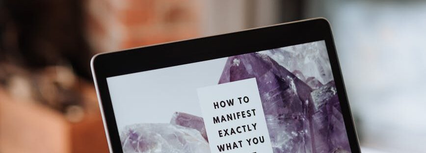 woman working with laptop with inspirational inscription