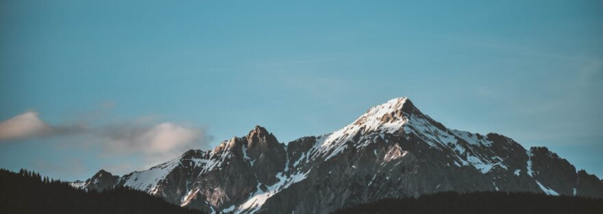 snow top mountain under clear sky