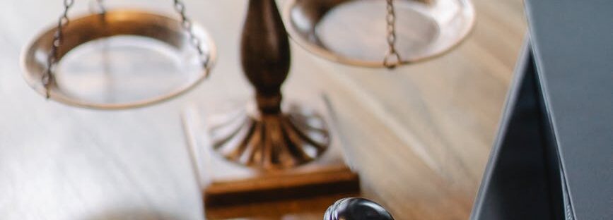 judges desk with gavel and scales