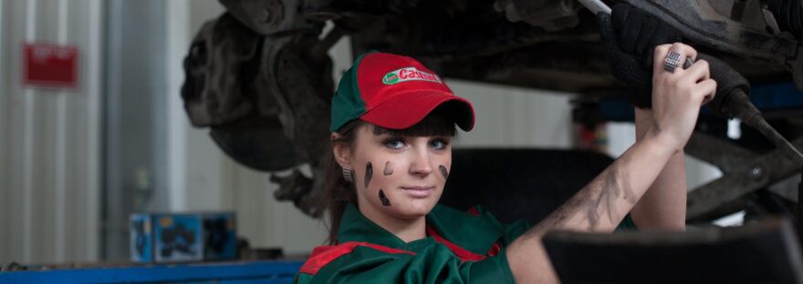 woman holding gray steel wrench