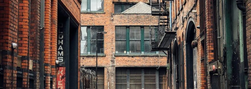 photo of street surrounded by buildings